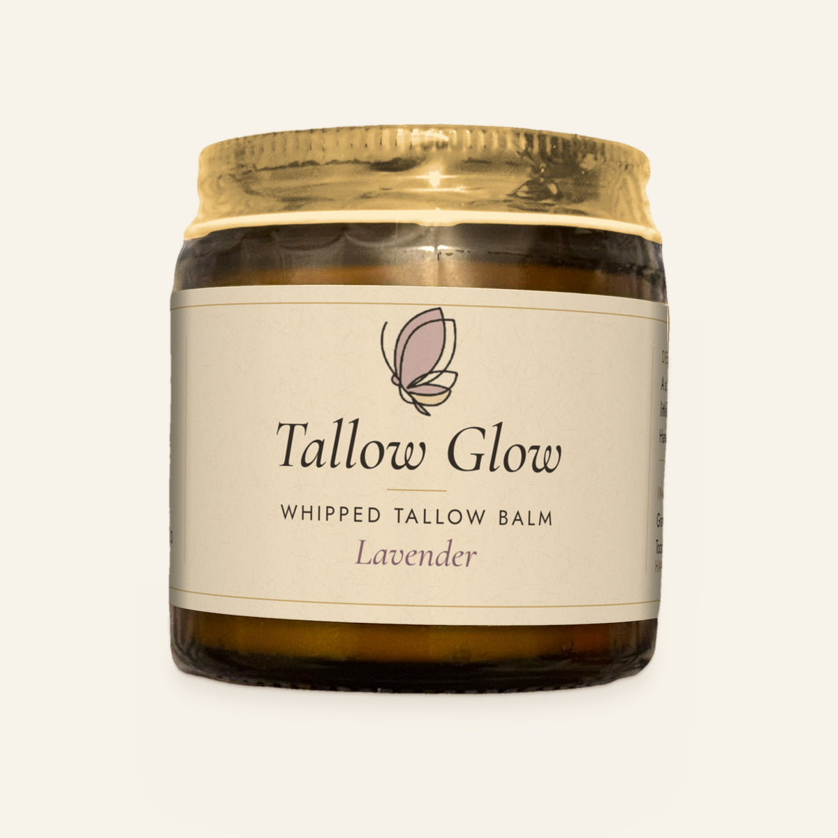 Tallow Roots Co. Lavender Tallow Glow whipped tallow balm in a glass jar with gold lid and cream label, front view on a plain cream background